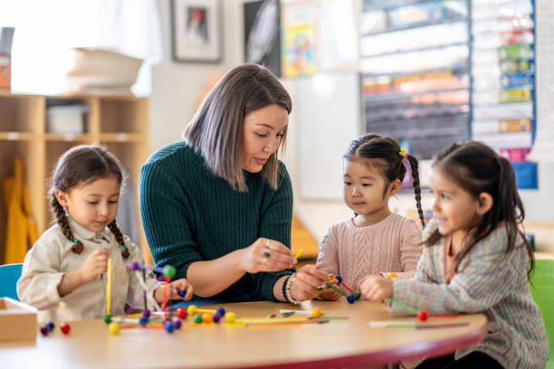 istock Kindergarten Students with Their Teacher 1457758406