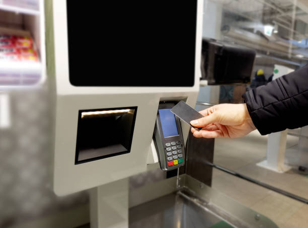 istock Customer pays his purchase at the supermarket,self checkout systems in  retail stores,Barcode scanner,Self checkout machine 1457759511