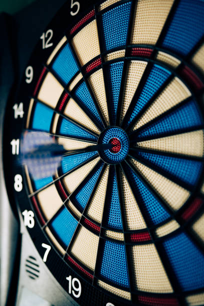 istock Dart hitting the center bull's eye 1457763778