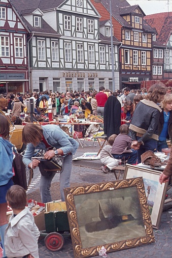 Celle, Lower Saxony, Germany, 1975. Street festival with a flea market in the old town of Celle. Also: locals, junk, pictures and visitors.