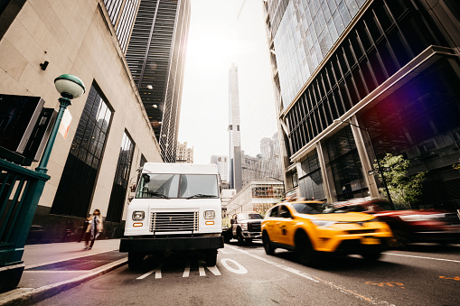 Post Service trucks in New York City lower Manhattan district.