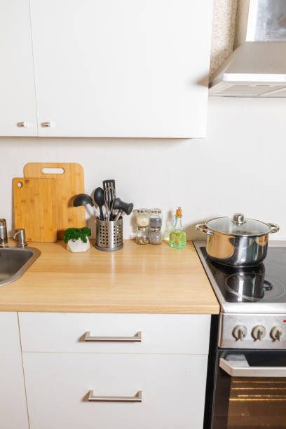 istock Scandinavian classic minimalistic kitchen with white and wooden details. Modern white kitchen clean contemporary style interior design. 1457767869