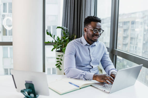 istock Young businessman working at his office 1457767977