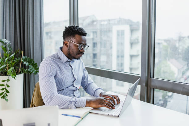 istock Young businessman working at his office 1457768023