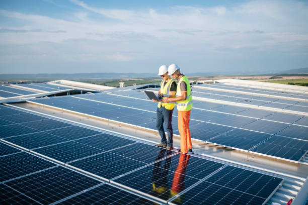Free Stock Photo of Engineers consult on solar panel installation ...