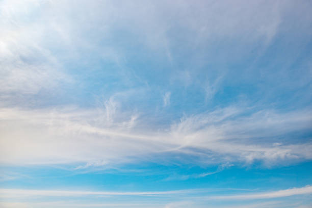 istock Beautiful white fluffy clouds on a bright blue sky 1457769223