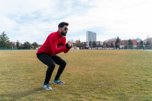 istock young man doing warm-up and stretching exercises 1457771457