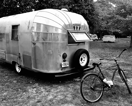 Vintage Travel Trailer - 9/17/2016: A vintage camper trailer parked at a camping site.