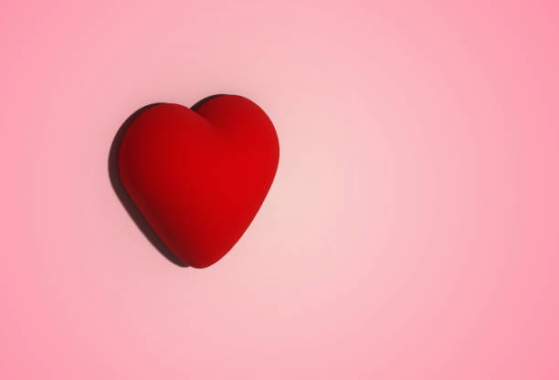Red voluminous heart on a pink background. 3D illustration