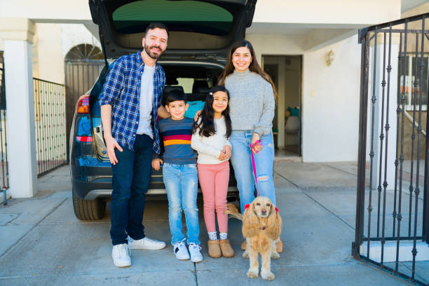 istock Happy family with kids ready for vacations with their dog 1457775237