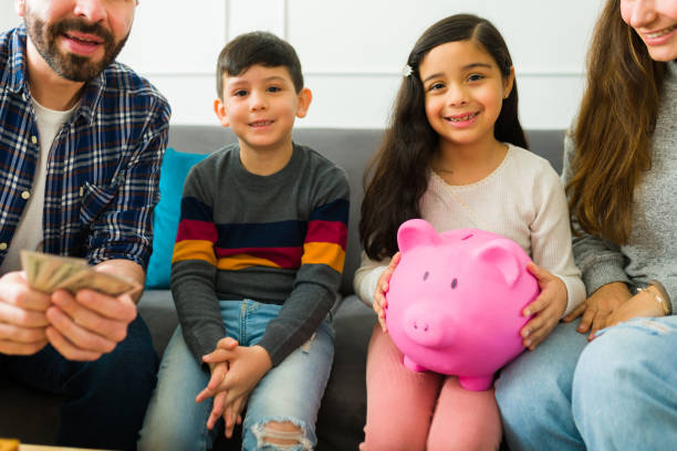 istock Parents and children saving money together 1457775385
