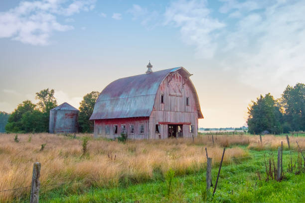 istock Old Weathered Red Barn at sunrise-Howard County, Indiana 1457775402
