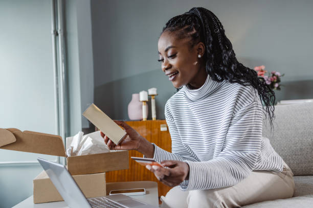 istock Young woman ordering new package online 1457775846