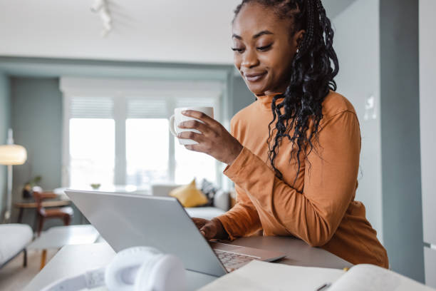 istock African-American female student working at home 1457775878