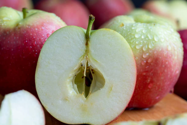 istock Sliced apple on a chopping board, close up 1457780545