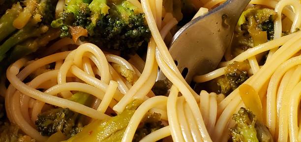 Noodles and broccoli  with a fork stock photo