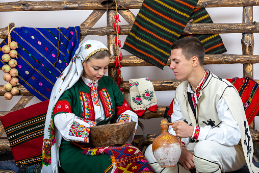 young people in traditional Bulgarian costumes.