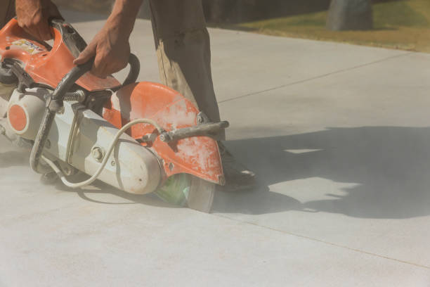 istock An employee of a construction company cuts concrete sidewalks with a diamond blade saw 1457788908