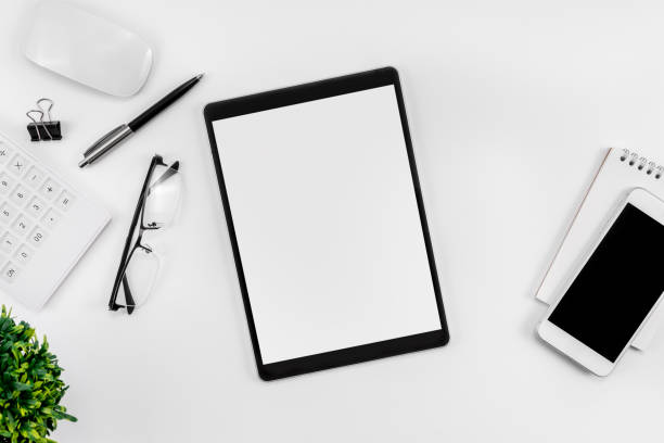 Modern white workspace top view, smartphone and tablet blank screen mockup, copy space stock photo