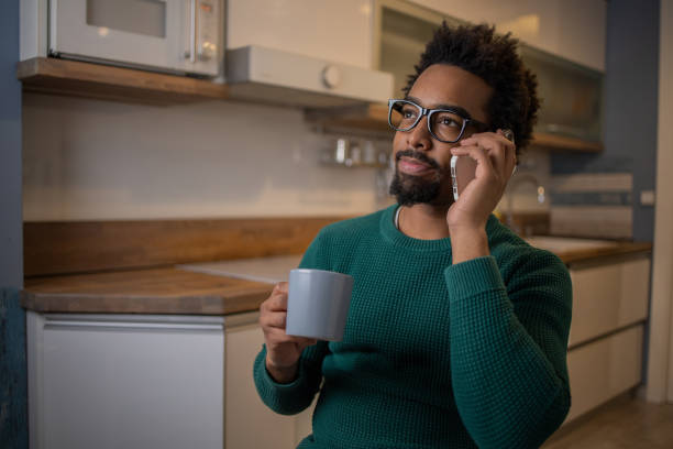 istock Portrait of a young man using smartphone 1457790487