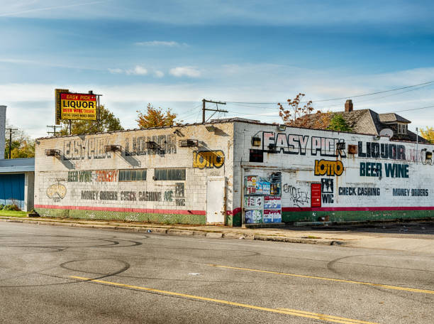 Liquor Store On Hamilton Avenue Detroit, Michigan - October 20, 2020: A package store on Hamilton Avenue provides liquor and other groceries to the local community of Highland Park in Detroit. highland park michigan stock pictures, royalty-free photos & images