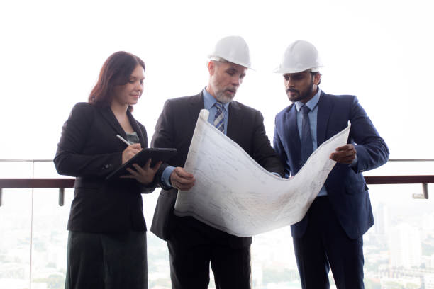 istock Senior architect and secretary inspector check blueprint and structure with contractor together at office, executive and supervisor or engineer planning project, industry and construction concept. 1457793371