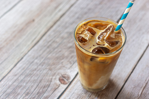 Cold Brew Coffee with Ice Cube\nDecoration with roasted coffee bean, wooden board\nHigh Resolution\nStock Photo\nFood Styling Photography