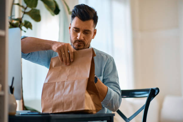 istock Entrepreneur having his food delivered while working at home. 1457799370