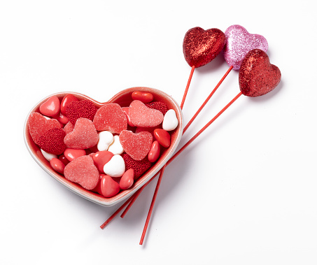 Pink heart shaped French macaron sweets with strawberriy flavor