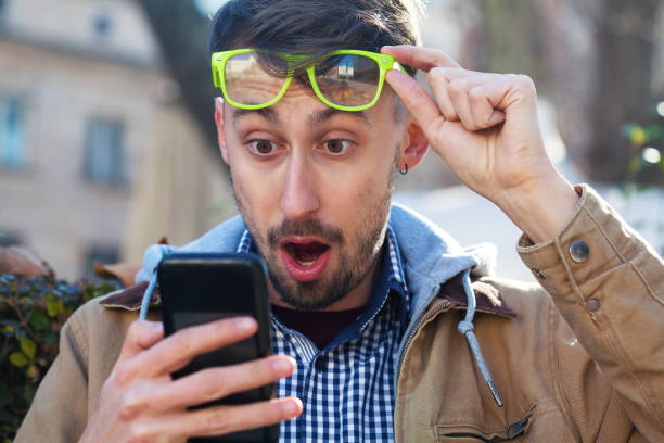 istock Young man reading bad news 1457801819
