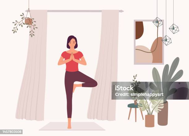 Woman With Standing Yoga Poses Practicing Balance And Strength At