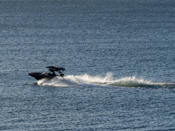 istock Speed boat in water leaving wake 1457803561