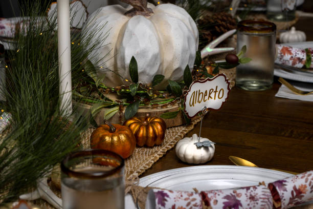 istock Table setting for a Thankgiving Dinner with pumpkin decorations and nametags 1457805670