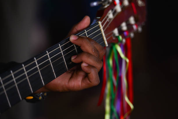 The hand of a pilgrim playing religious during a religious celebration