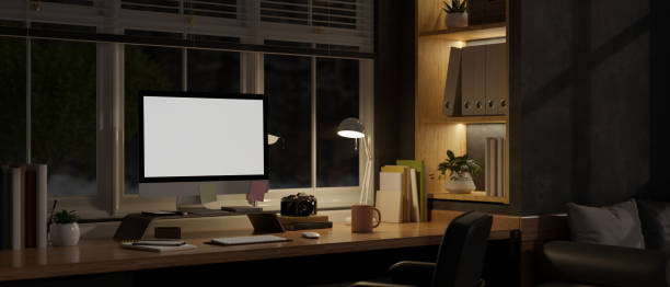 istock Modern and contemporary home working room at night with computer mockup. dark home office 1457808828