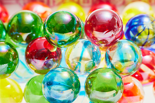 A collection of colorful marbles isolated on white background.