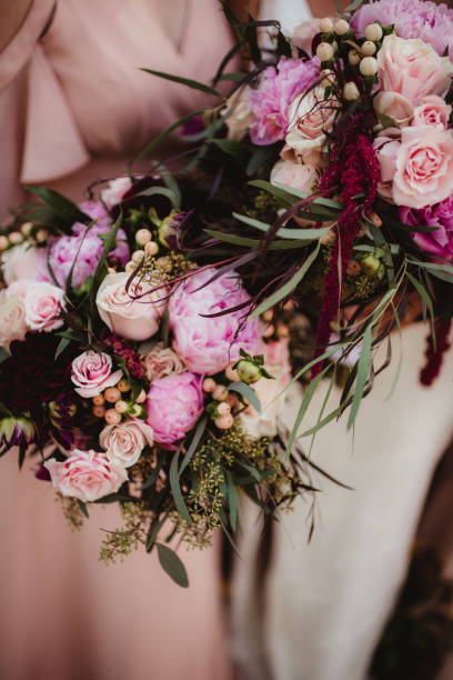 istock Roses and peonies in wedding bouquets 1457812084