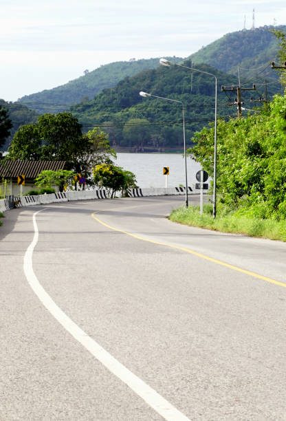 istock Empty road at hill with lake background 1457812918