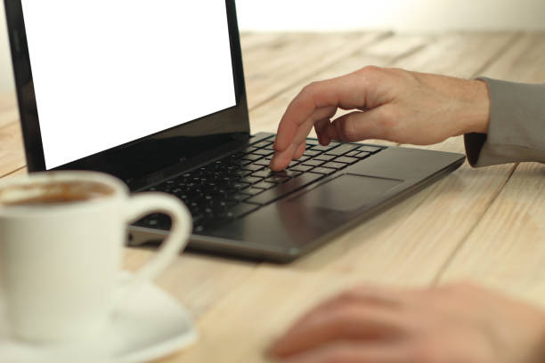 istock person typing on a laptop with a white screen 1457812955