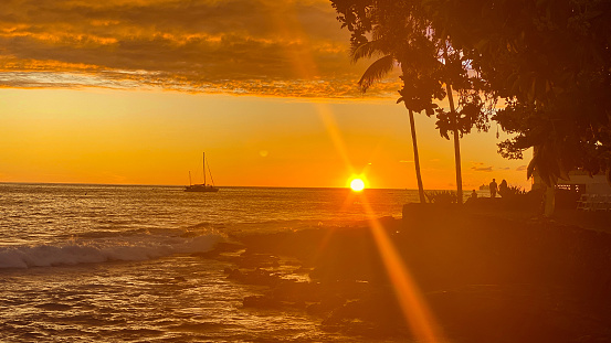 The sun sets on yet another day in Kona, Hawaii. The beauty of Hawaii is on full display until the very end of the day.