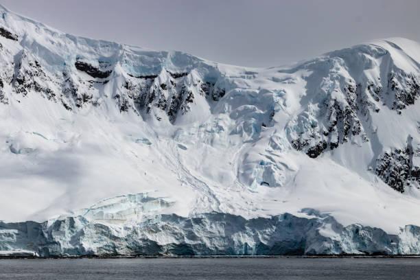 istock Antarctic mountain ridge; rock, snow and blue ice visible. 1457815697