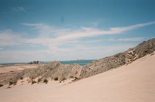 Sand dunes next to ocean in Mexico
