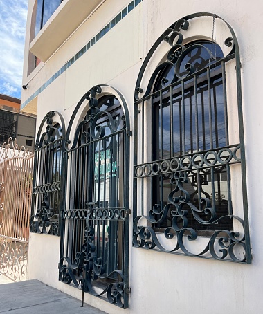 Ornate ironwork on windows and dirt in Cabo San Lucas Mexico