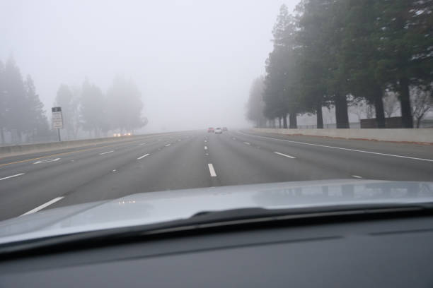 istock Driving on a freeway on a foggy day 1457820615