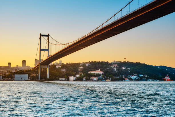 Bosphorus bridge at sunset Istanbul, Turkey. Bosphorus bridge at sunset, view of the European part of the city bosphorus stock pictures, royalty-free photos & images