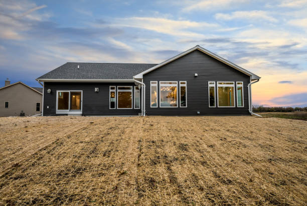 istock Pretty sunset and a home with dark siding 1457825734