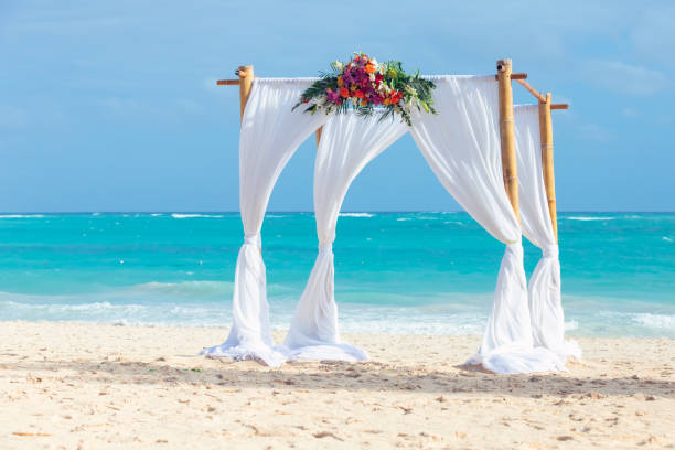 istock Empty Marriage gazebo with white curtains and flowers decoration 1457829106