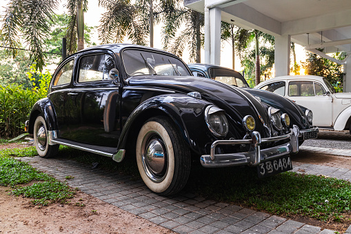 Colombo, Sri Lanka - November 30, 2021: Vintage black Volkswagen Kafer stands on a parking lot