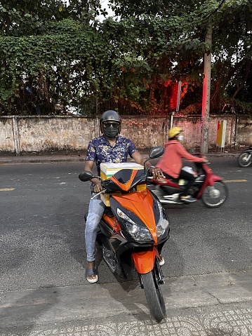 A young man driving motorcycle