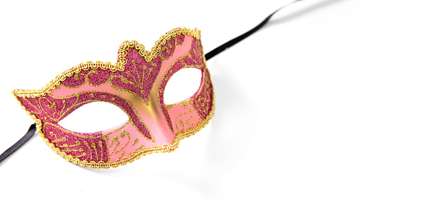Carnival Venetian mask pink color with golden decoration isolated on white background, copy space, banner
